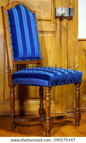 Antique classic style chair produced from natural wood, studio