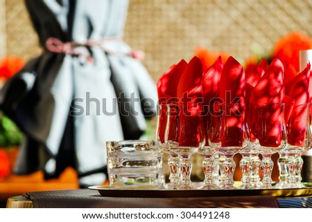 Set of glasses with napkins ready for clients in the street cafe, France