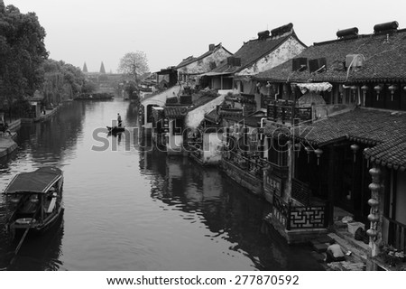 Xitang, China - April 15, 2015: Traditional Chinese Houses in Xitang, which is a Famous Water Town in Zhejiang Province in China. The Photo in Black and White Shows the the Houses along the River.