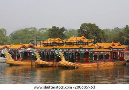 Beijing, China - April 26, 2015: Dragon Boats at Summer Palace, Beijing, China. The Summer Palace is a vast ensemble of lakes, gardens and palaces and it covers 2.9 square kilometers.