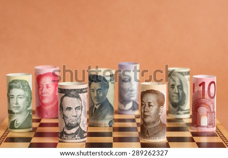 Currency War. Photo Shows Banknotes from Different Countries on a Chess Board.