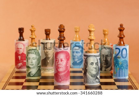 Currency War. Photo Shows Banknotes from Different Countries on a Chess Board.