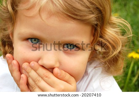 stock photo : portrait of small pretty girl with curly hair and blue eyes