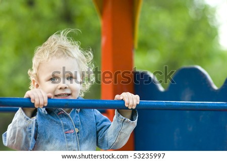 Close-up of Cute 2-year-old Girl on Playground