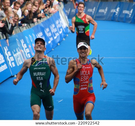 STOCKHOLM - AUG 23: Richard Murray (South Africa) and Mario Mola (Spain) has a tough fight to reach the 4th place in the ITU World Triathlon in Stockholm, Sweden