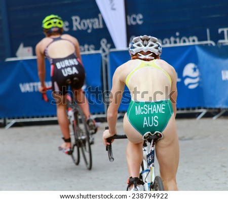STOCKHOLM - AUG 23, 2014: Charlotte McShane (AUS) and Chelsea Burns (USA) cycling in the Women\'s ITU World Triathlon series event August 23, 2014 in Stockholm, Sweden