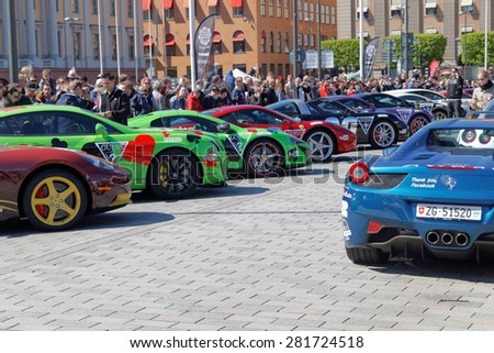 STOCKHOLM - MAY 23, 2015: Fast sports-cars admired by the audience before the start of the public event Gumball 3000, May 23, 2015 in Stockholm, Sweden