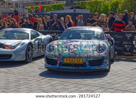 STOCKHOLM - MAY 23, 2015: Fast sports-cars admired by the audience before the start of the public event Gumball 3000, May 23, 2015 in Stockholm, Sweden