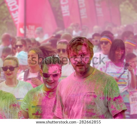 STOCKHOLM - MAY 23, 2015: Lots of people covered with pink color powder during the public event The Color Run, May 23, 2015 in Stockholm, Sweden