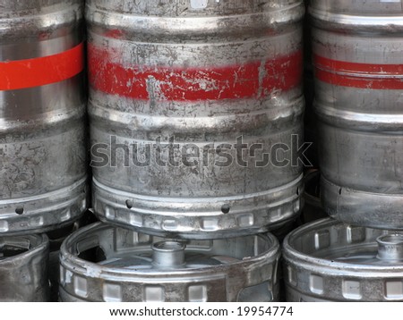 Abstract of stacked aluminum bulk beer containers.