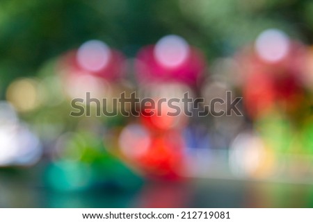Blurred unfocused city view at day time. Unfocused people in the theme park