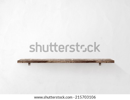Empty wooden shelf on the wall