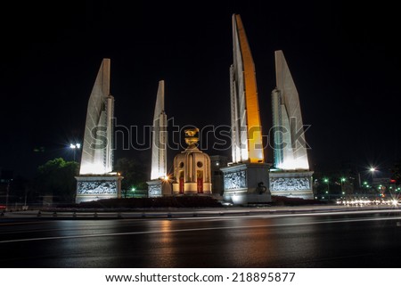 The democracy monument was photographed during night by using slow speed shutter technique. The color lines in this picture are automotive lighting.