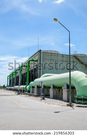 cooling towers with big green pipes in natural gas power plant, Ratchaburi, Thailand.