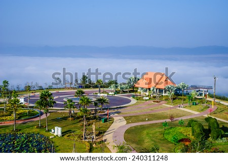 A scenic pavilion with a beautiful garden in the sea mist, top of reclamation field, Mae Moh mine, Lampang, Thailand.