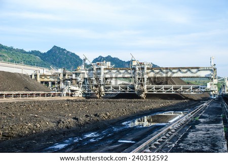 A heavy machine is called 'Reclaimer', operates in coal stock pile, Mae Moh mine, Lampang, Thailand.