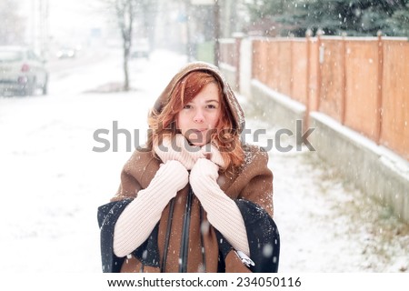 Girl when outside is snowing