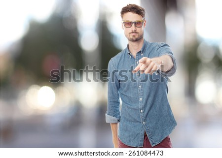 young cool man pointing at you