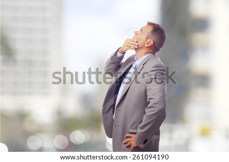 thoughtful businessman on the street