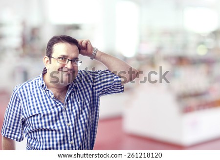 nerd man scratching head in a library