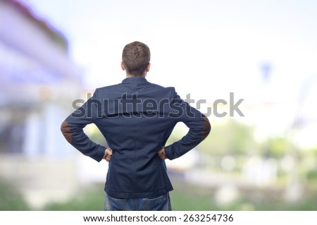 Man in suit back looking at something