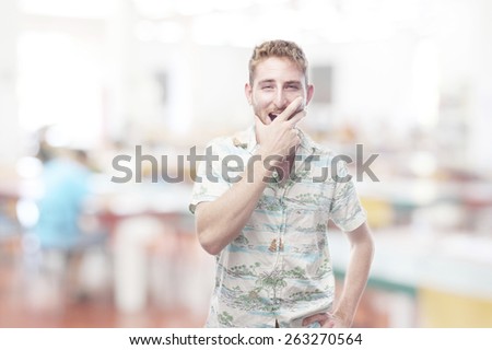 ginger young man with hawaiian shirt yawning