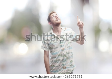 ginger young man pointing up
