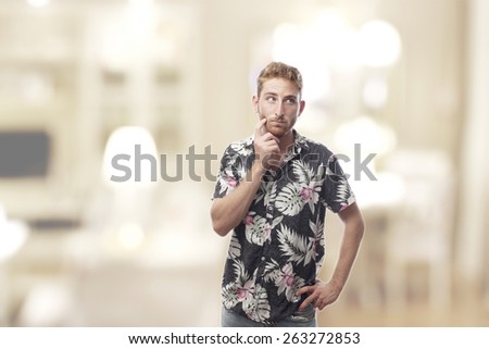 thoughtful ginger young man with hawaiian shirt