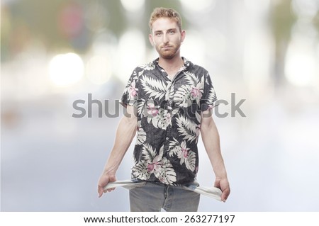 ginger young man with hawaiian shirt no money in his pockets