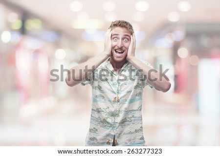 exciting  ginger young man with hawaiian shirt