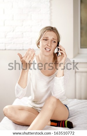 European woman with cell phone talking