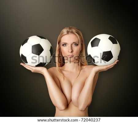 beautiful naked woman with soccer balls looking at camera, with open hands