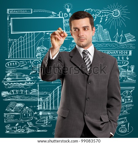 Idea concept, man businessman writing something on glass board with marker