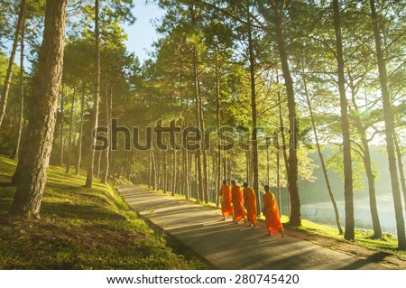 Buddhist Monk Walking for Receive Food at Pang Ung in Mae Hong Son-Thailand