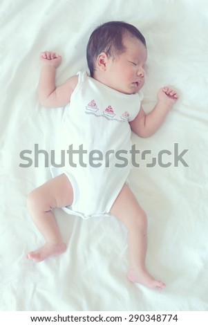 Soft focus and blurry of Sleeping newborn baby, vintage style color effect
