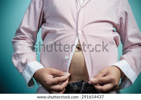 Fat boy can\'t  button up his shirt, Healthy and lose weight concept