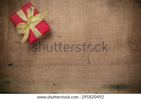 Christmas rustic background - vintage planked wood with gift and free text space