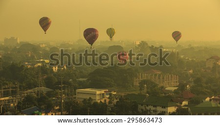 CHIANG MAI, THAILAND - December 6 2014: A lot of balloons start they flight over city, Vibrant style color effect