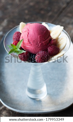 Raspberry Sorbet Frozen fruit dessert with fresh fruit garnish