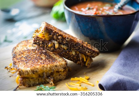 Fresh tomato soup with grilled onion and cheese sandwich