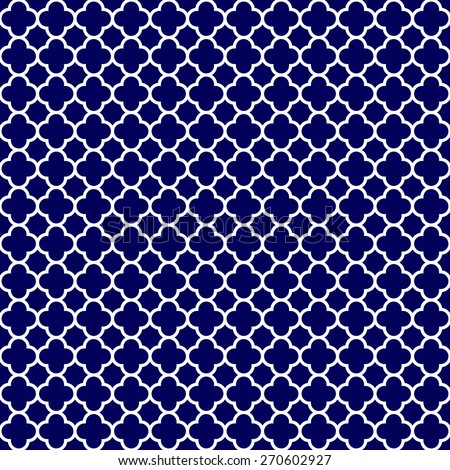 Cloverleaf quatrefoil lattice pattern with white gothic lattice on a navy blue background. This is a seamlessly repeating pattern background.