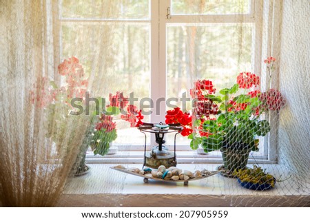 Decorated window with flowers and different art works