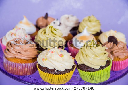 A small cake designed to serve one person called cupcake: different colors of cream - different feelings.