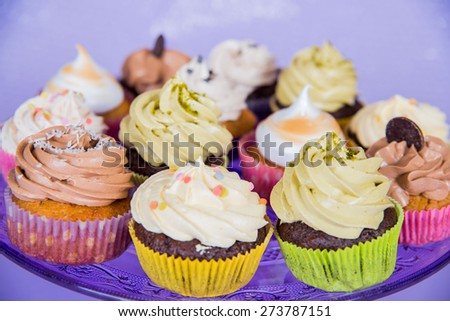 A small cake designed to serve one person called cupcake: different colors of cream - different feelings.