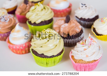 A small cake designed to serve one person called cupcake: different color of cream - different feeling.