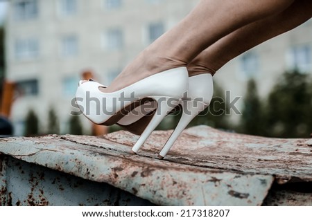 Girl in white high heels