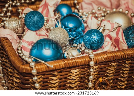 Christmas decoration with balloons in the box on warm background