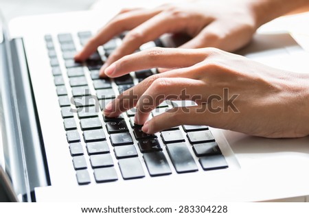 Close up woman hands is typing on keyboard