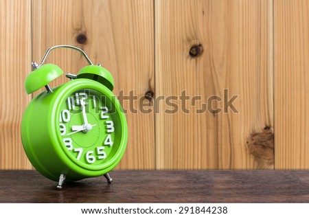 Clock on Wooden Floor with Wood Background