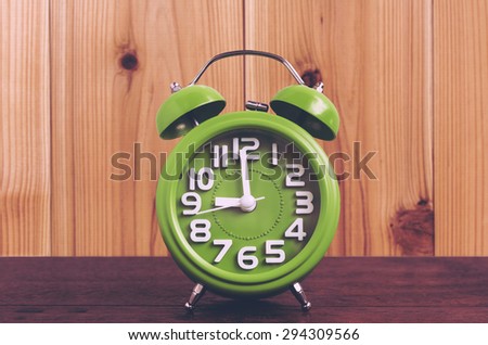 Clock on Wooden Floor with Wood Background , Vintage Style